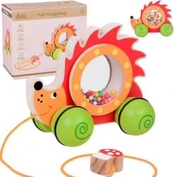 Riccio trainabile in legno con palline colorate