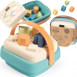 Smoby piccolo triciclo verde nel cesto di bioplastica