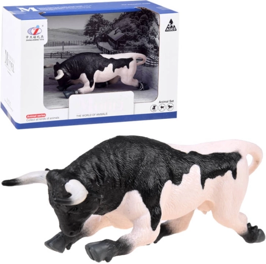 Figura animale di toro bianco e nero pronto all'attacco