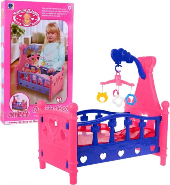 Lettino per bambole con giostrina e biancheria da letto, 3+