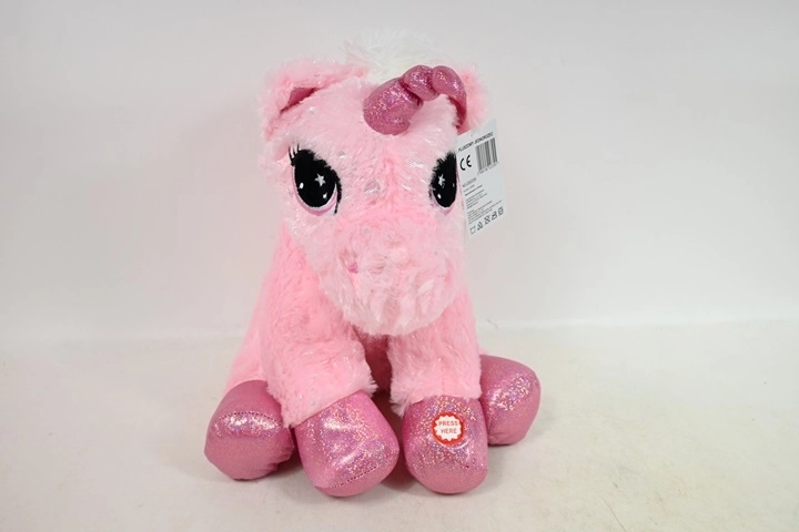 Unicorno di peluche seduto con suono