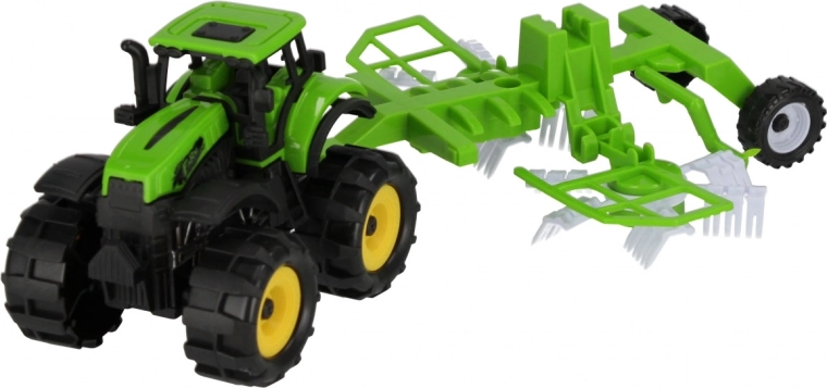 Trattore con attrezzo agricolo collegato