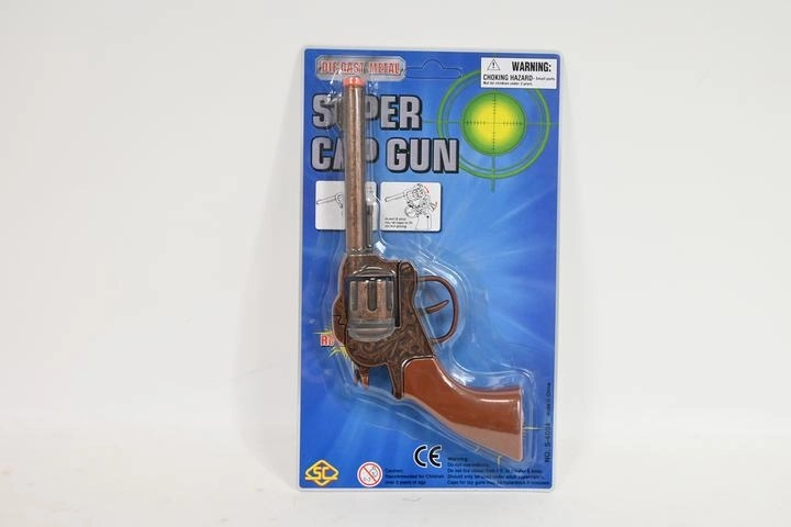 Pistola a capsule in metallo in blister