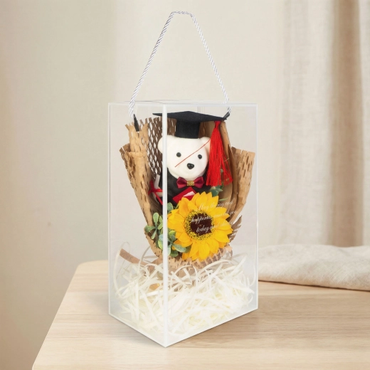 Decorazione artificiale con girasole e orsetto per la laurea