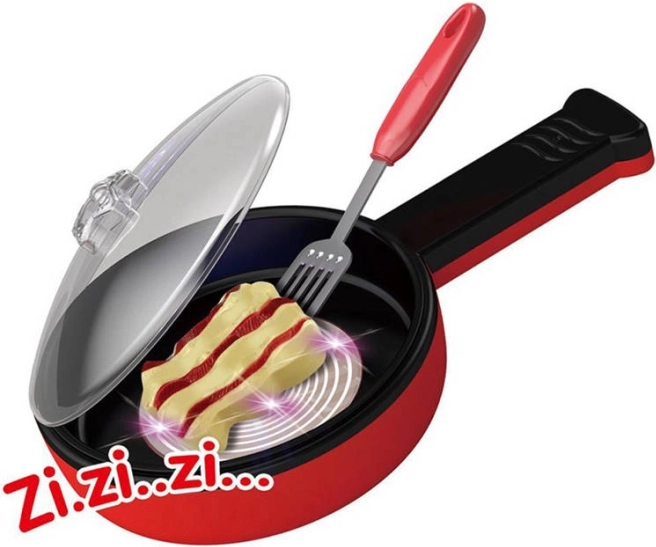 Set da cucina magico con padella ed effetti di frittura