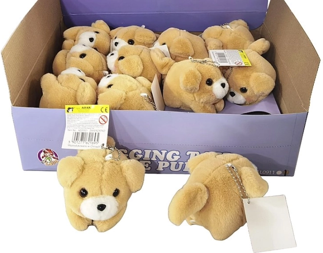 Cagnolino di peluche con meccanismo a carica che scodinzola