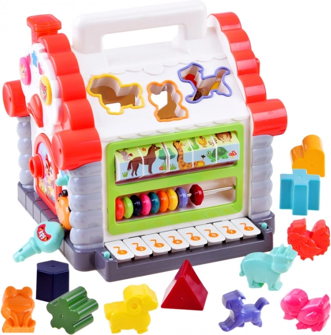 Casetta interattiva – mini tastiera musicale, incastri di forme e animaletti per bambini 18+ mesi
