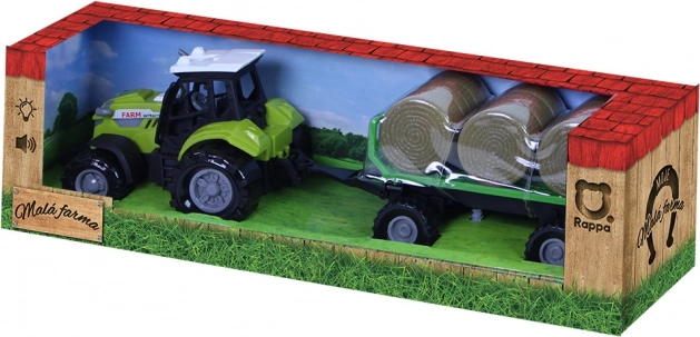 Trattore con suoni e luci con rimorchio e balle di fieno