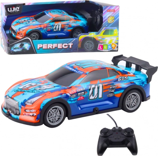 Auto da corsa RC con carrozzeria luminosa, arancione–turchese