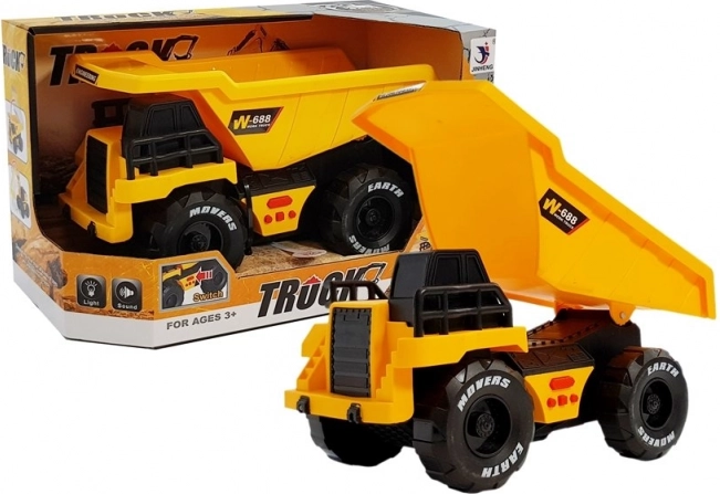 Camion ribaltabile per bambini giallo con meccanismo a frizione, luci e suoni