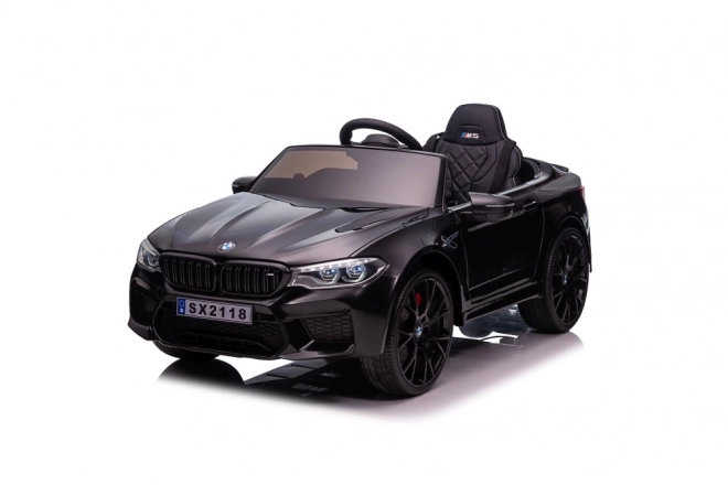 Auto elettrica BMW M5 nera verniciata