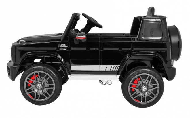 Mercedes AMG G63 per bambini Laccato nero + telecomando + MP3 LED + partenza lenta + EVA + cinture