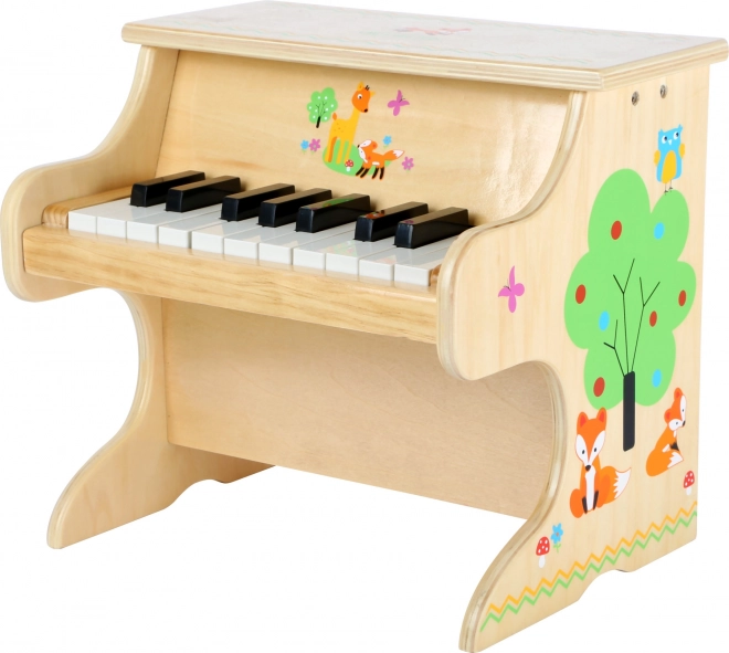 Piccolo pianoforte in legno con volpe