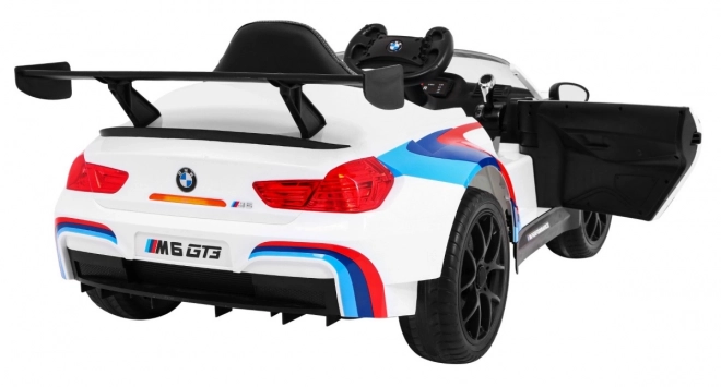 BMW M6 GT3 Auto a batteria per bambini Bianco + ventilazione + suoni MP3 Luci + telecomando