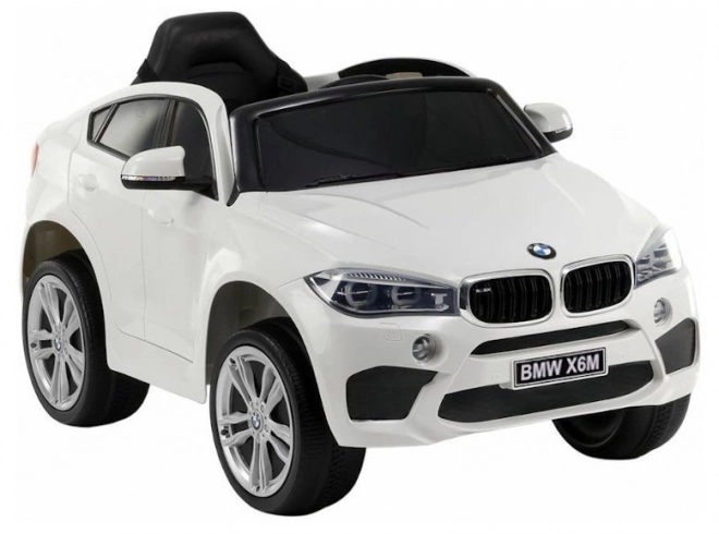 Auto elettrico BMW X6 bianco con sedili in pelle ed EVA