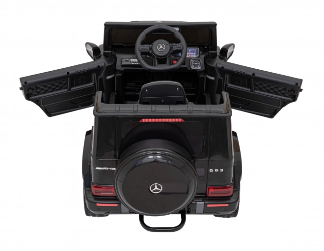 Mercedes AMG G63 per bambini nero + telecomando + MP3 LED + partenza lenta + EVA + cinture di sicurezza