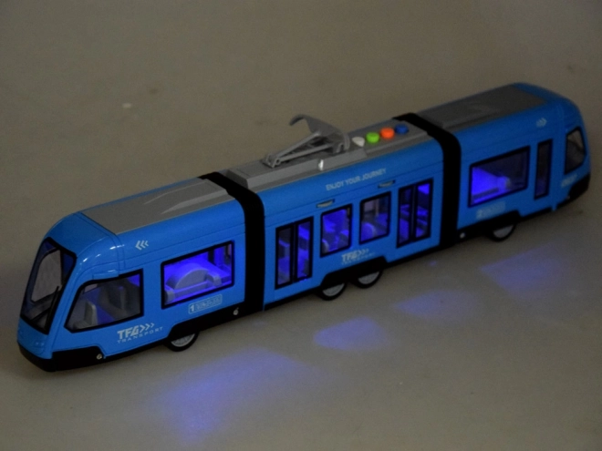 Tram articolato blu con luci e suoni