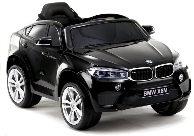 Auto elettrico per bambini BMW X6 nero con sedili in ecopelle