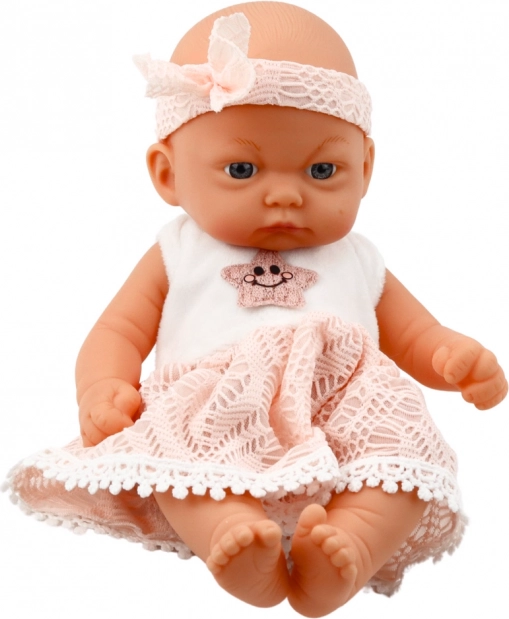 Bambola bebè in vestito rosa con cerchietto