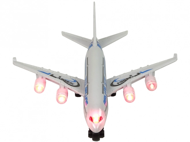 Aereo passeggeri bianco con dettagli blu luci e suoni