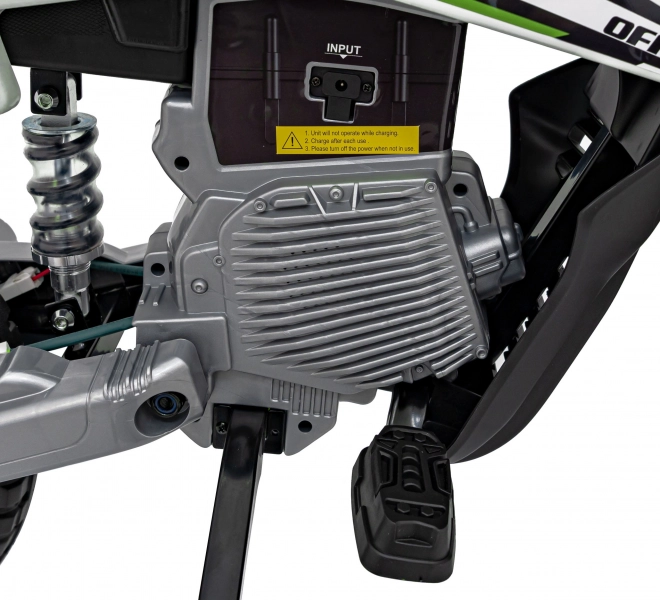 Moto verde per bambini a batteria con pannello audio e ruote in EVA