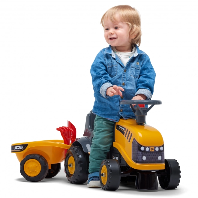 Odrážedlo Baby JCB giallo con rimorchio e pala