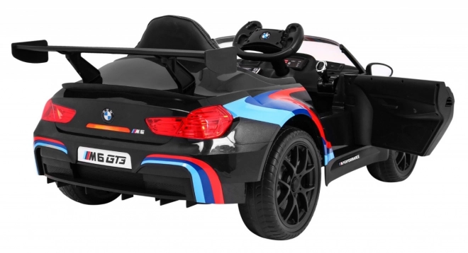 BMW M6 GT3 Auto a batteria per bambini nero + ventilazione + suoni MP3 Luci + telecomando