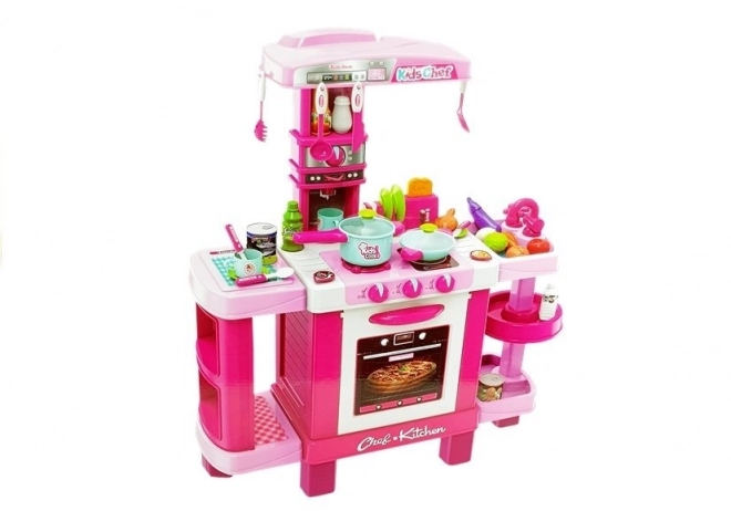 Grande cucina rosa per bambini con tostapane e macchina da caffè