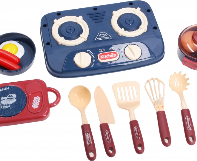 Set da cucina con fornello, stoviglie e alimenti