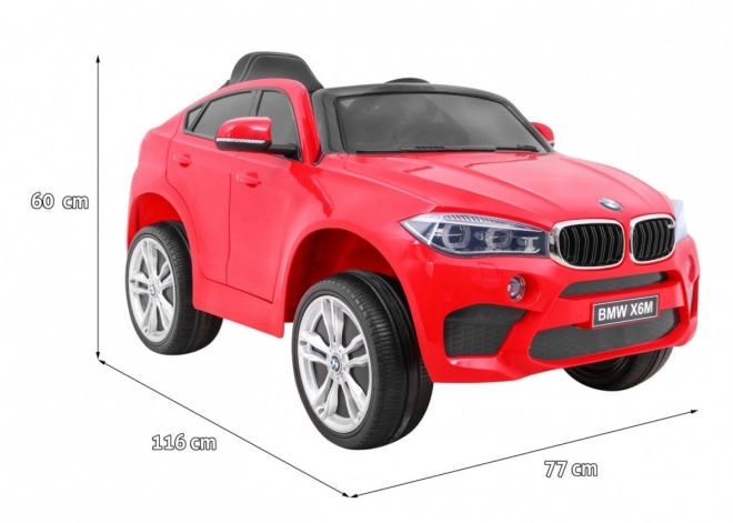 BMW X6M Auto elettrico per bambini rosso + telecomando + EVA + avvio lento + pannello audio + LED