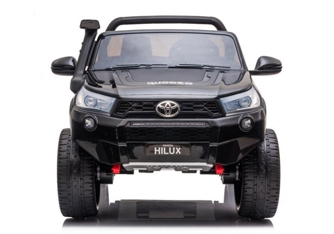 Auto elettrico per bambini Toyota Hilux bianco – Nera