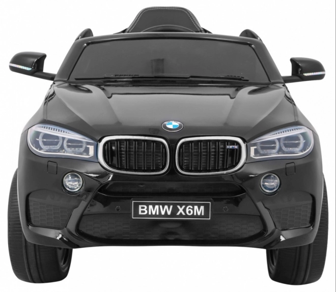 Auto elettrico per bambini BMW X6M nero + telecomando + EVA + avvio lento + pannello audio + LED