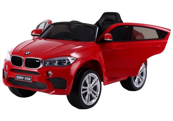 Macchina a Batteria BMW X6 Rossa in Pelle e Ruote EVA