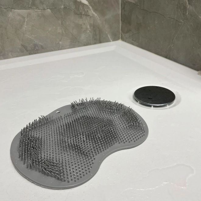 Spazzola massaggiante in silicone per doccia con ventose grigio