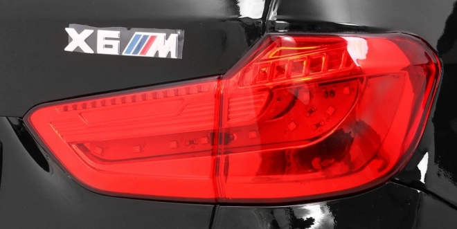 Auto elettrico per bambini BMW X6M nero + telecomando + EVA + avvio lento + pannello audio + LED