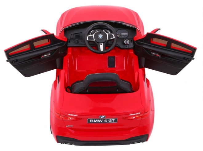 BMW 6 GT Auto a batteria rosso + telecomando + partenza lenta + EVA + cinture + LED MP3