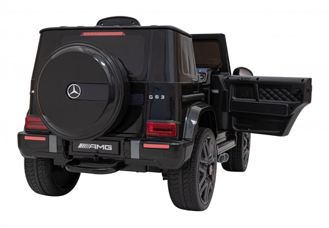 Mercedes AMG G63 per bambini nero + telecomando + MP3 LED + partenza lenta + EVA + cinture di sicurezza