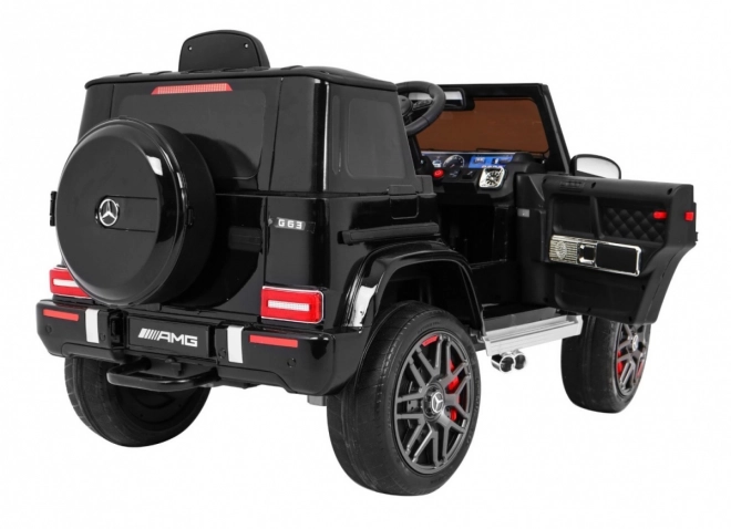 Mercedes AMG G63 per bambini Laccato nero + telecomando + MP3 LED + partenza lenta + EVA + cinture