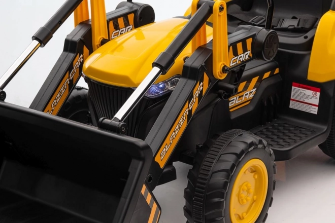Trattore a batteria con pala gialla