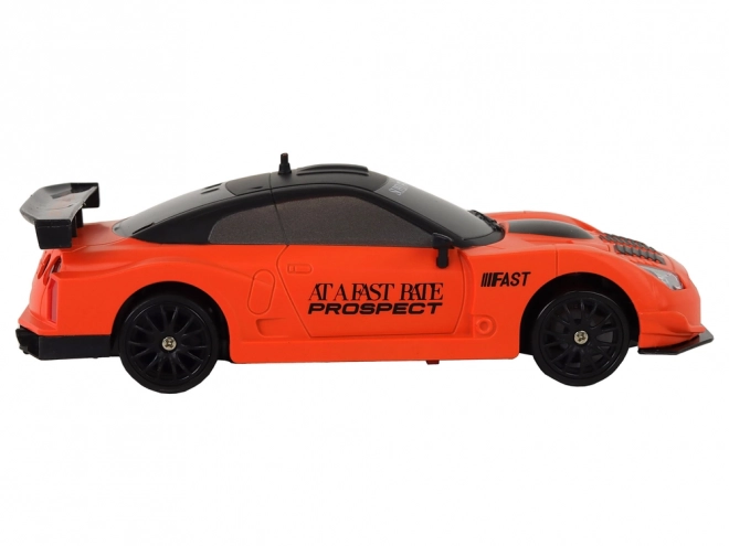 Auto Sportivo Telecomandato RC 1:24 Arancione con Ruote Intercambiabili