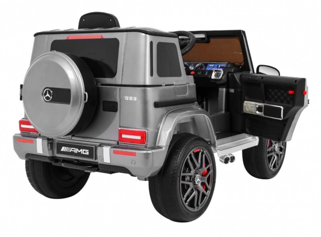 Mercedes AMG G63 per bambini Vernice argento + telecomando + MP3 LED + avvio lento + EVA + cinture