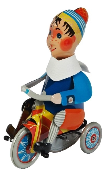 Ragazzo su triciclo a molla in metallo 15cm in scatola Kovap