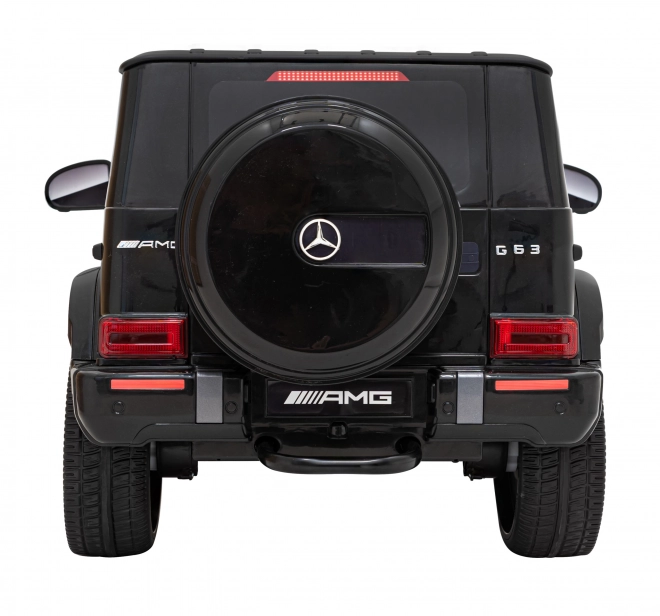 Mercedes AMG G63 per bambini nero + telecomando + MP3 LED + partenza lenta + EVA + cinture di sicurezza