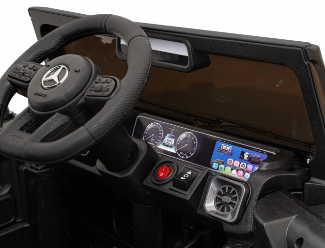 Mercedes AMG G63 per bambini nero + telecomando + MP3 LED + partenza lenta + EVA + cinture di sicurezza