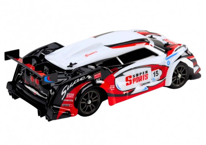 Auto da corsa RC 1:16 con ruote intercambiabili bianco-rosso