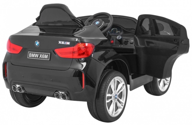 Auto elettrico per bambini BMW X6M nero + telecomando + EVA + avvio lento + pannello audio + LED