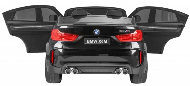 BMW X6M XXL pro 2 bambini nera + Telecomando + Pelle ecologica + Cinture di sicurezza + Avvio lento + MP3 USB + LED