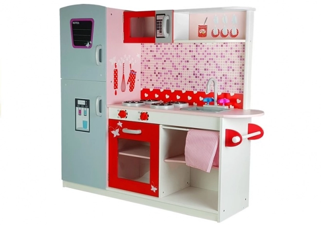 Cucina in legno per bambini con frigorifero e microonde