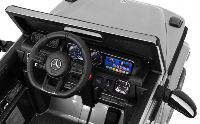 Mercedes AMG G63 per bambini Vernice argento + telecomando + MP3 LED + avvio lento + EVA + cinture