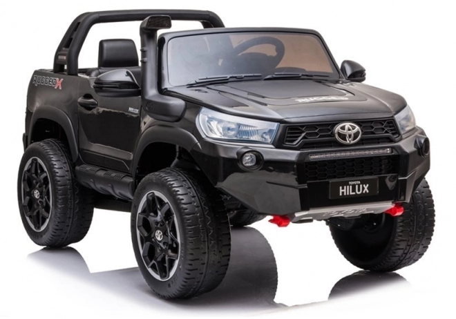 Auto elettrico per bambini Toyota Hilux bianco – Nera